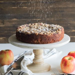 This Apple Crumb Cake is full of warm spices, apple chunks, and Greek yogurt to keep it soft! This recipe has a super thick crumb layer and is a perfect fall cake.