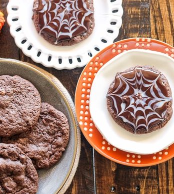 These Ultimate Chocolate Spiderweb Cookies are perfect for Halloween! They're double chocolate cookies, full of chocolate chunks, and topped with white and dark chocolate ganache.