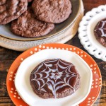 These Ultimate Chocolate Spiderweb Cookies are perfect for Halloween! They're double chocolate cookies, full of chocolate chunks, and topped with white and dark chocolate ganache.