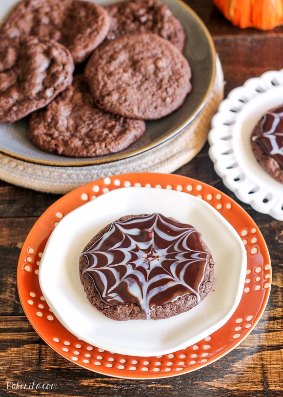 These Ultimate Chocolate Spiderweb Cookies are perfect for Halloween! They're double chocolate cookies, full of chocolate chunks, and topped with white and dark chocolate ganache.