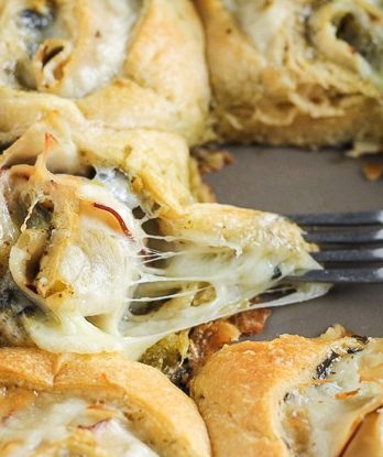 These Cheesy Turkey Pesto Rolls make a great snack or appetizer perfect for tailgating or the holidays! Gooey mozzarella makes this easy four ingredient recipe absolutely irresistible.