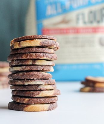 This recipe for Chocolate Vanilla Swirl Icebox Cookies makes tons of cookies that are perfect for holiday baking. They look beautiful and you can keep a roll in your fridge or freezer, ready to slice 'n bake!