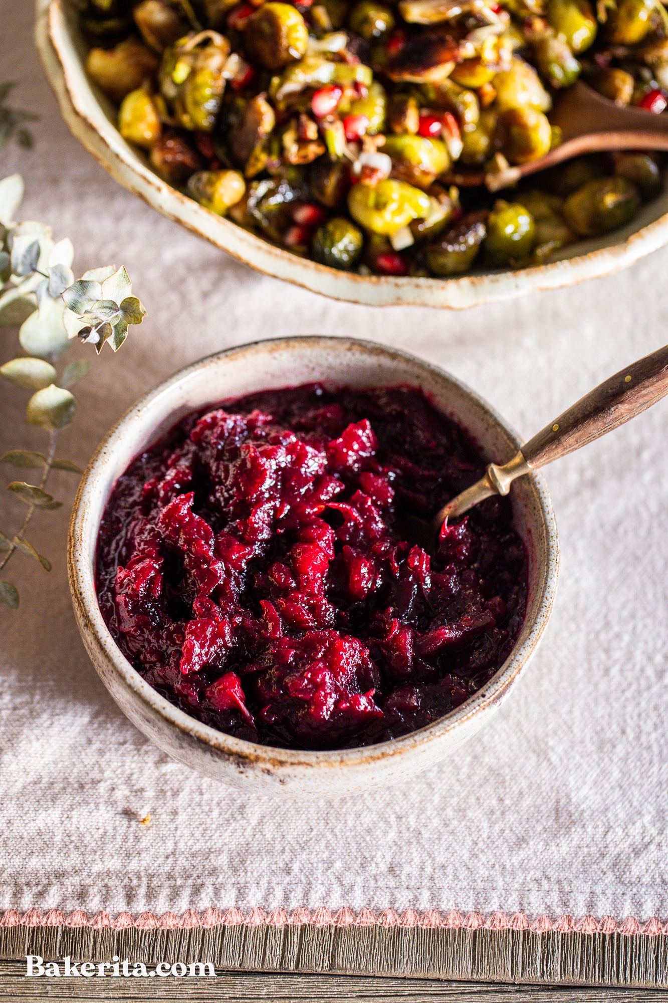 This Healthy Paleo Cranberry Sauce is simple to make, delicious, and sweetened with maple syrup to keep it refined sugar-free. Orange zest and warm spices give this cranberry sauce incredible flavor, and it's done in 15 minutes.