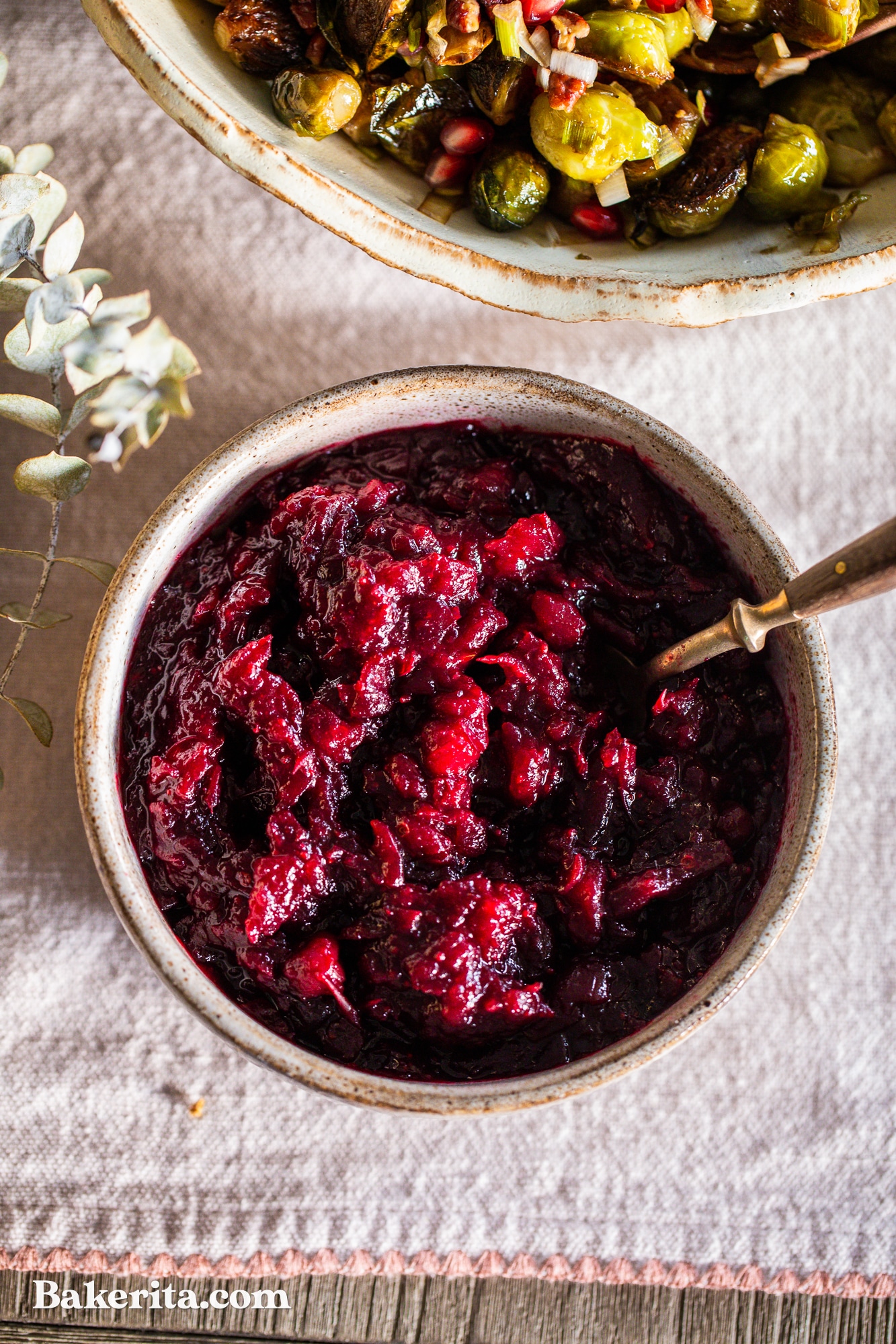 This Healthy Paleo Cranberry Sauce is simple to make, delicious, and sweetened with maple syrup to keep it refined sugar-free. Orange zest and warm spices give this cranberry sauce incredible flavor, and it's done in 15 minutes.