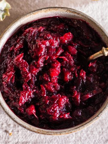 This Healthy Paleo Cranberry Sauce is simple to make, delicious, and sweetened with maple syrup to keep it refined sugar-free. Orange zest and warm spices give this cranberry sauce incredible flavor, and it's done in 15 minutes.