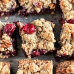 These Paleo Cranberry Crumb Bars use leftover cranberry sauce to make an irresistible gluten-free, refined sugar-free, and vegan dessert. The crumb mixture doubles as the crust and crumb topping.