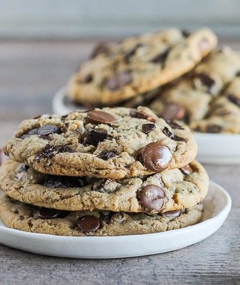 These Giant Peanut Butter Cup Chocolate Chunk Cookies are big, chewy, and full of peanut butter, peanut butter cups, and rich melted chocolate! If you love chocolate and peanut butter, these cookies will become a quick favorite.