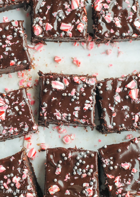 These Peppermint Brownies are classic fudge brownies with peppermint extract and mint chips for a chilly winter twist. This easy brownie recipe is topped with dark chocolate ganache and crushed candy canes.