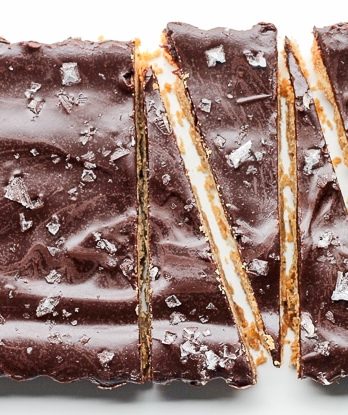 These Brown Butter Shortbread with Dark Chocolate + Sea Salt are made with high quality ingredients to create a delicious shortbread cookie that’s the perfect addition to any holiday party. Dark chocolate and flaky sea salt make this shortbread even more irresistible!