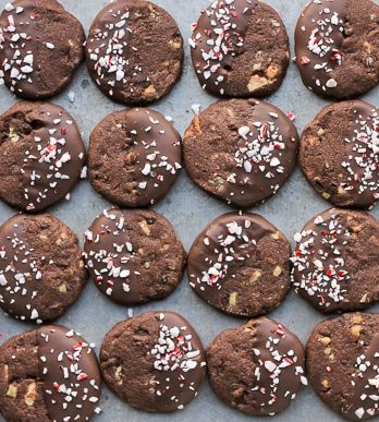 Chocolate Mint Shortbread Cookies are easy to make slice n' bake cookies that are perfect for gifting! These crunchy chocolate cookies have a minty chocolate coating and sprinkle of crushed candy canes.