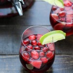 This Cranberry Lime Sangria is a sparkling + festive take on sangria! This is the perfect refreshing cocktail for a crowd.