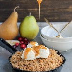 This Pear Cranberry Ginger Crisp is a mix of sweet, tart, and little spicy with a buttery shortbread cookie crumble! This festive holiday dessert is gluten-free and doubles easily.