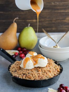 This Pear Cranberry Ginger Crisp is a mix of sweet, tart, and little spicy with a buttery shortbread cookie crumble! This festive holiday dessert is gluten-free and doubles easily.