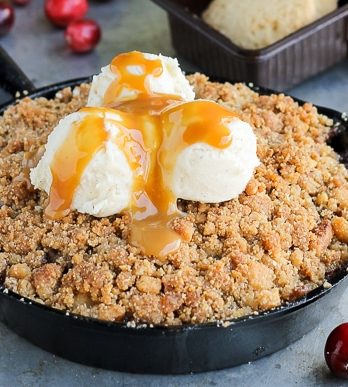 This Pear Cranberry Ginger Crisp is a mix of sweet, tart, and little spicy with a buttery shortbread cookie crumble! This festive holiday dessert is gluten-free and doubles easily.