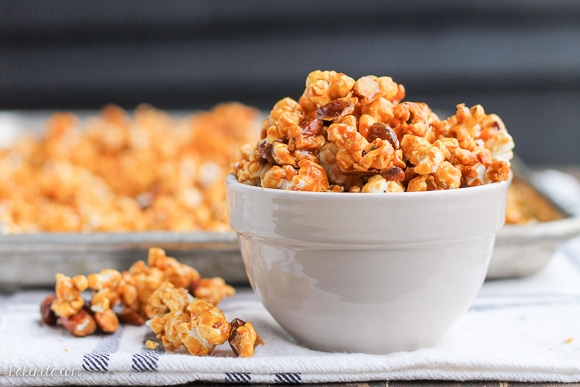 This Salted Honey Almond Caramel Corn is an addictive snack you can give as a gift or serve to a crowd. This caramel corn is made without corn-syrup and uses honey instead - it also has a sprinkle of sea salt!