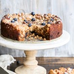 This Blueberry Crumb Cake has a thick layer of pecan crumble atop a rich and juicy blueberry cake that is bursting with fresh blueberries! This cake is perfect served simply dusted with powdered sugar or a bit of whipped cream.