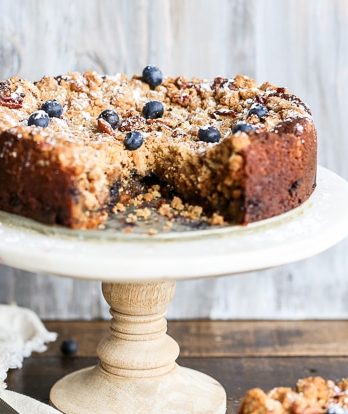 This Blueberry Crumb Cake has a thick layer of pecan crumble atop a rich and juicy blueberry cake that is bursting with fresh blueberries! This cake is perfect served simply dusted with powdered sugar or a bit of whipped cream.