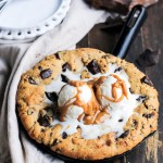 This Peanut Butter Chocolate Chip Skillet Cookie is a peanut butter lover's dream!! The peanut butter cookie stays soft in the center while the edges get crispy, and a layer of peanut butter in the center takes this skillet cookie over the top.