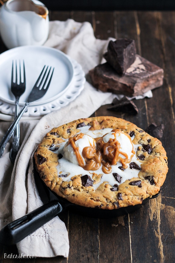 This Peanut Butter Chocolate Chip Skillet Cookie is a peanut butter lover's dream!! The peanut butter cookie stays soft in the center while the edges get crispy, and a layer of peanut butter in the center takes this skillet cookie over the top.