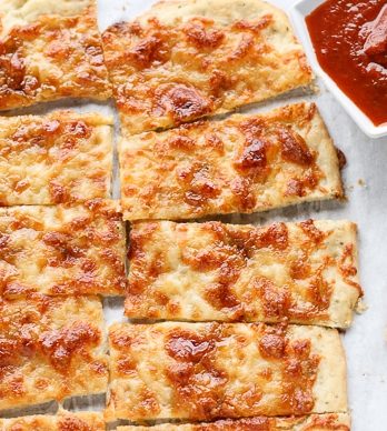 Sweet Sticks were a favorite of my friends and I in college - these bread sticks are topped with melted mozzarella, garlic, and brown sugar for a salty-sweet combo that's surprisingly irresistible!