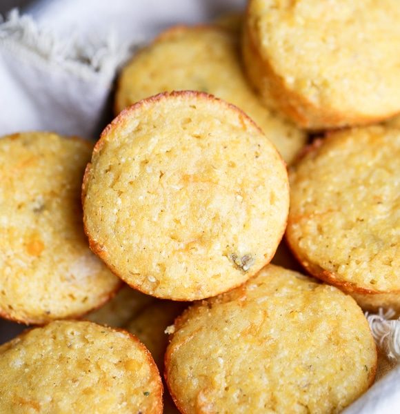 These Green Chile Corn Muffins are the best corn muffins I've ever had! Flavored with green chiles & cheddar cheese, they are perfect served with a bowl of chili or a drizzle of honey.