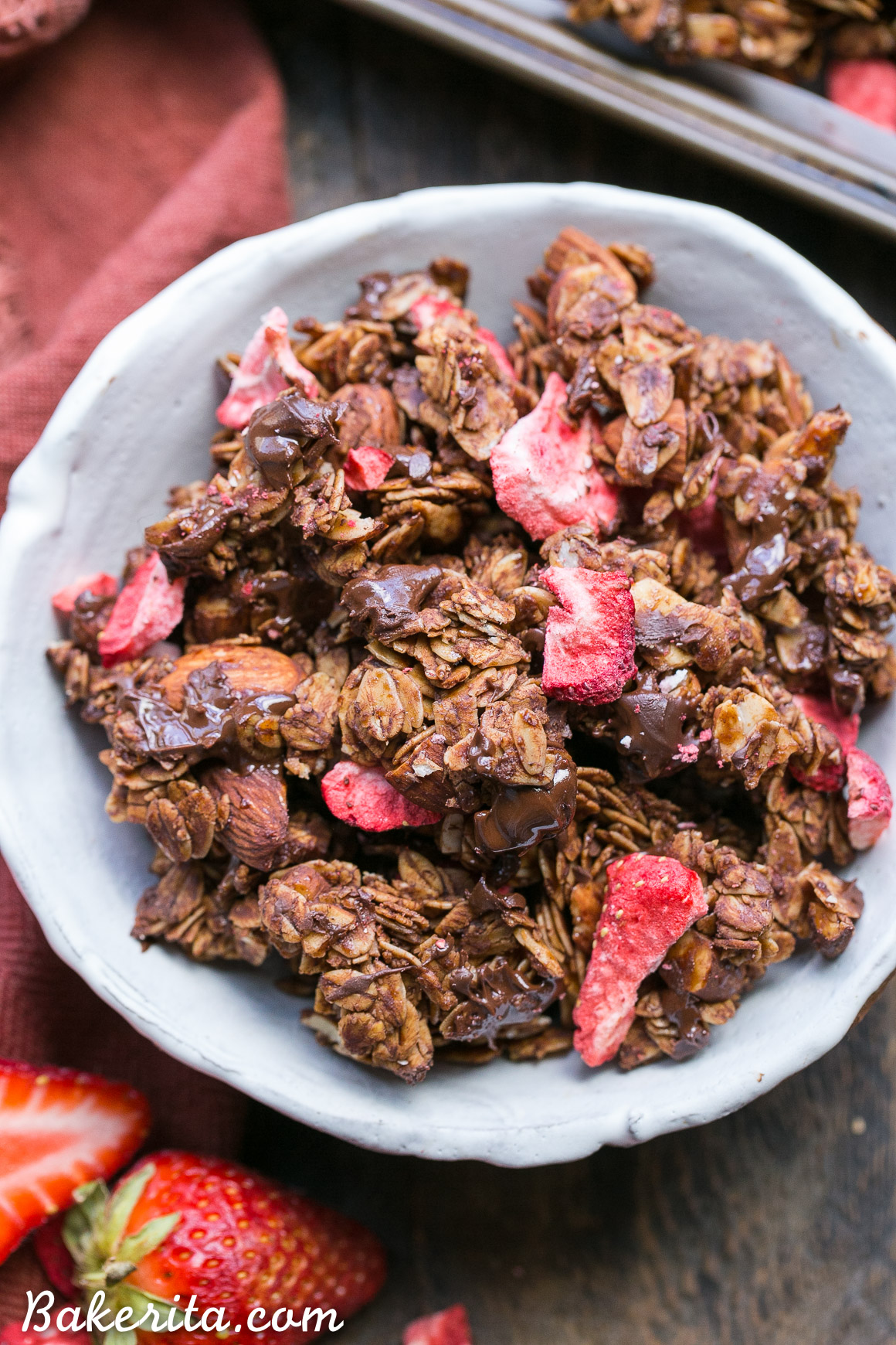 Chocolate Strawberry Granola is healthy enough to eat for breakfast, but it's so delicious you'll want to have it for dessert too! This simple and easy granola recipe is gluten-free, vegan, and refined sugar free, and it's loaded with chocolate & strawberry flavor.