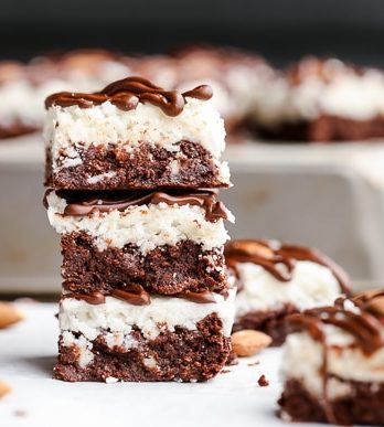 These Almond Joy Brownies have a coconut butter topping and a drizzle of dark chocolate - you'd never guess that these indulgent brownies are gluten-free, refined sugar-free, and Paleo!