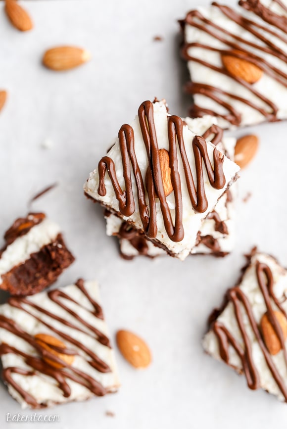 These Almond Joy Brownies have a coconut butter topping and a drizzle of dark chocolate - you'd never guess that these indulgent brownies are gluten-free, refined sugar-free, and Paleo!