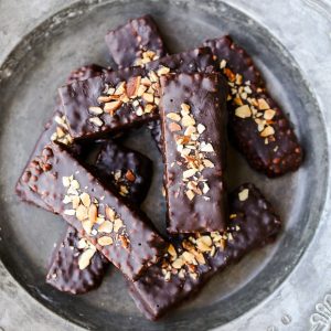 These easy no-bake Chocolate Covered Almond Butter Puffed Millet Bars are the perfect breakfast treat or snack! This gluten free, refined sugar free, and vegan recipe has only seven ingredients.