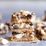 These Dark Chocolate Macadamia Nut Magic Bars are a sweet & gooey dessert bar with a hint of tropical flair. You'll be hooked after one bite of the gooey vegan caramel and buttery macadamia nuts on a gluten-free coconut lime crust.
