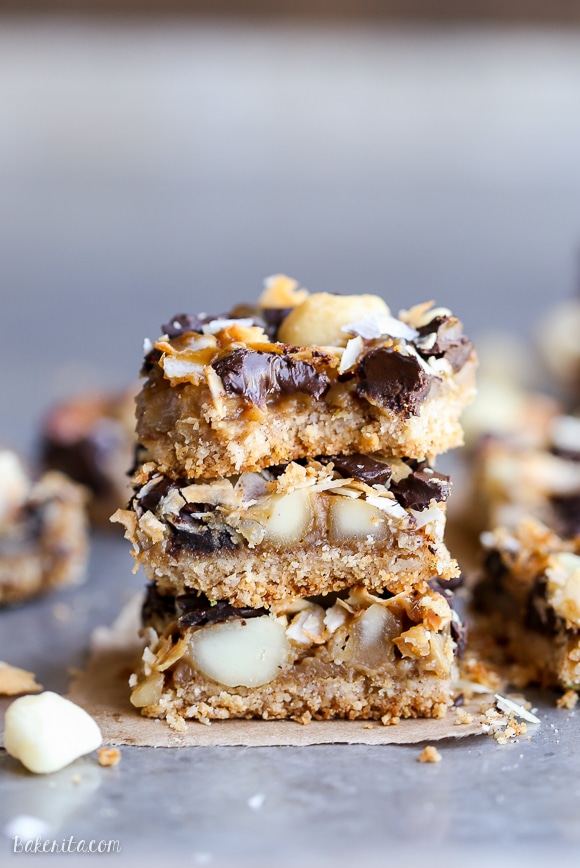 These Dark Chocolate Macadamia Nut Magic Bars are a sweet & gooey dessert bar with a hint of tropical flair. You'll be hooked after one bite of the gooey vegan caramel and buttery macadamia nuts on a gluten-free coconut lime crust.