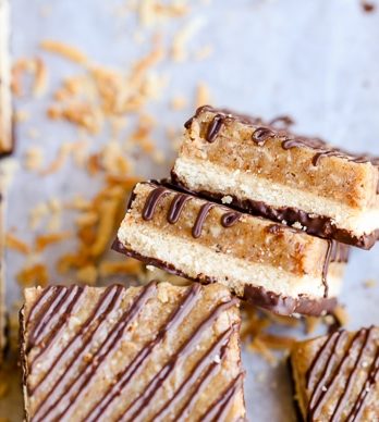 These Samoa Bars have a shortbread crust, a layer of toasted coconut caramel, and a dark chocolate drizzle! They're a gluten-free, Paleo, vegan, and guilt-free way to enjoy your favorite Girl Scout cookie.