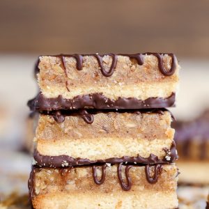 These Samoa Bars have a shortbread crust, a layer of toasted coconut caramel, and a dark chocolate drizzle! They're a gluten-free, Paleo, vegan, and guilt-free way to enjoy your favorite Girl Scout cookie.