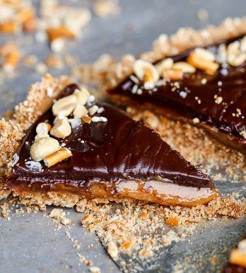 This Chocolate Peanut Butter Tart has a crunchy pretzel crust and smooth peanut butter caramel filling, all topped with luscious chocolate ganache. This recipe is gluten-free and vegan.