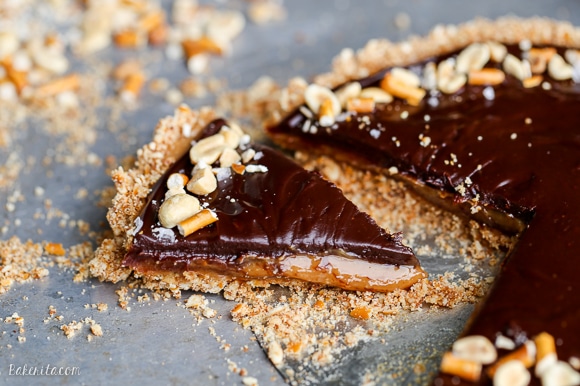 This Chocolate Peanut Butter Tart has a crunchy pretzel crust and smooth peanut butter caramel filling, all topped with luscious chocolate ganache. This recipe is gluten-free and vegan.