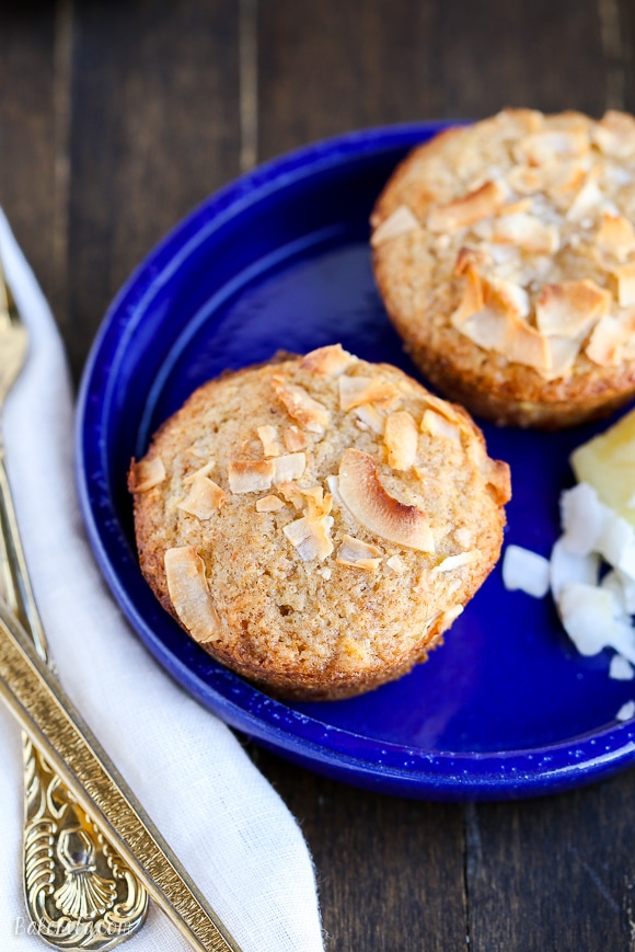 Have a taste of the tropics with these Vegan Pineapple Coconut Muffins! They're super soft, full of tropical flavor, and no one would ever guess that they are dairy-free + vegan.