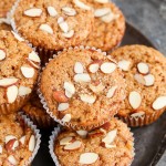 Take advantage of rhubarb's limited season with these Vegan Rhubarb Muffins! These fluffy muffins are refined sugar free and topped with crunchy sliced almonds.