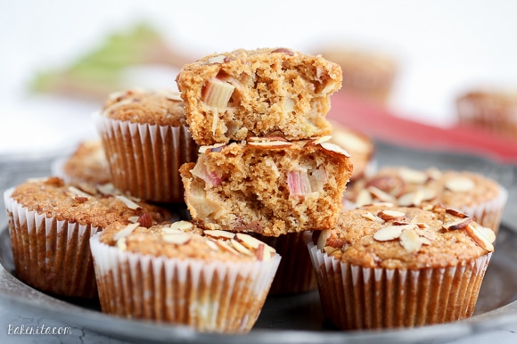 Take advantage of rhubarb's limited season with these Vegan Rhubarb Muffins! These fluffy muffins are refined sugar free and topped with crunchy sliced almonds.