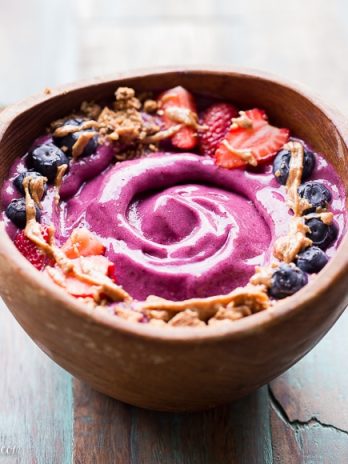 This Berry Pitaya Smoothie Bowl is made from mixed berries, banana, and pitaya - also known as dragonfruit! Top with fresh fruit and other toppings for a nutritious and delicious breakfast or brunch.