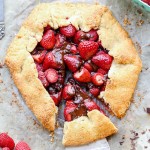 This rustic Chocolate Strawberry Galette will satisfy your sweet tooth guiltlessly! This simple Paleo dessert features fresh strawberries and dark chocolate chunks, folded into a flaky gluten-free crust.