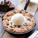 This Paleo Chocolate Chip Skillet Cookie is the ultimate gooey dessert! This gluten free and refined sugar free skillet cookie is a healthier alternative to the classic Pizookie. Use big chocolate chunks to make it extra chocolatey!
