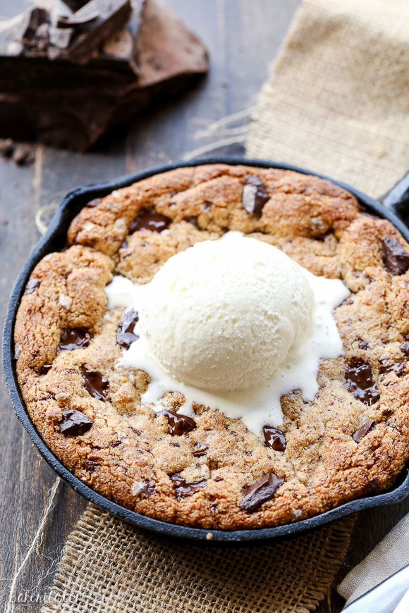 This Paleo Chocolate Chip Skillet Cookie is the ultimate gooey dessert! This gluten free and refined sugar free skillet cookie is a healthier alternative to the classic Pizookie. Use big chocolate chunks to make it extra chocolatey!