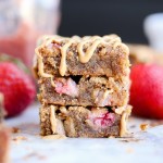 These Peanut Butter & Jelly Blondies are a super gooey and delicious way to enjoy this classic sandwich combo! These dessert bars are gluten-free, grain-free and refined sugar-free.