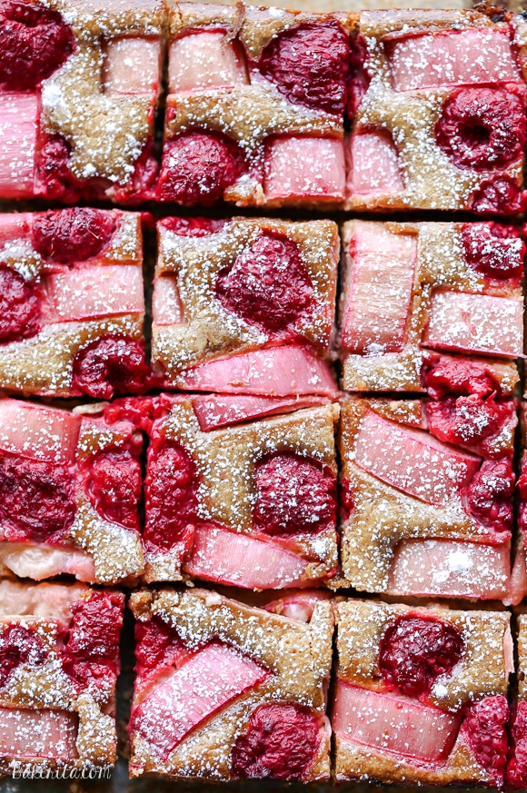 These Raspberry Rhubarb Almond Bars have a crisp almond flour crust topped with soft almond frangipane, fresh raspberries, and tart rhubarb. This recipe is Paleo, gluten free + refined sugar free.