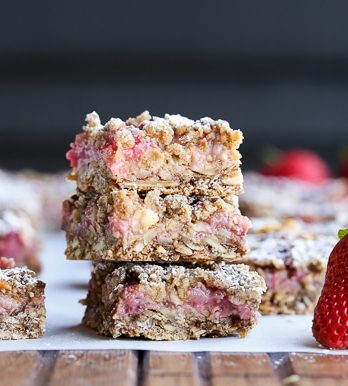 These Strawberry Oatmeal Crumble Bars feature fresh strawberries and an oatmeal crumb crust that doubles as the crumble topping! This quick and easy recipe is gluten-free and vegan.