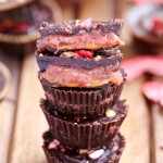 These Chocolate Peanut Butter & Jelly Cups are homemade peanut butter cups with an added layer of jam or jelly! This healthier candy recipe is only 5 ingredients, and uses an easy refined sugar free chocolate recipe.