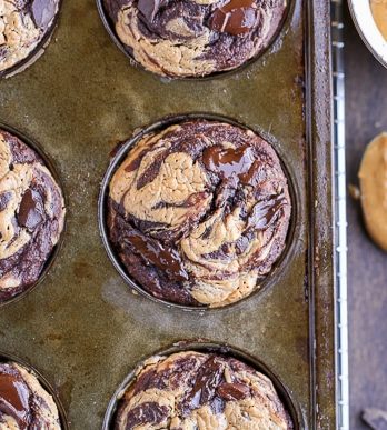 These Chocolate Peanut Butter Banana Muffins are loaded with chocolate chunks and have a peanut butter swirl - you'd never guess that they're gluten-free and the batter is sweetened entirely with bananas!