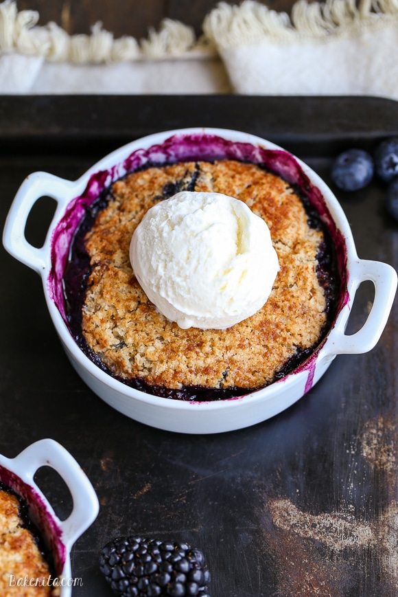 This Blackberry + Blueberry Cobbler is healthy enough for breakfast, but sweet + delicious enough to be dessert! These gluten-free, Paleo, and vegan cobblers have a crisp and gooey topping.