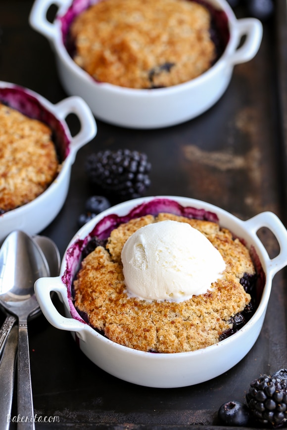 This Blackberry + Blueberry Cobbler is healthy enough for breakfast, but sweet + delicious enough to be dessert! These gluten-free, Paleo, and vegan cobblers have a crisp and gooey topping.