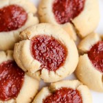 These Jam Thumbprint Cookies are a simple and delicious cookie made with only four ingredients! You won't be able to have just one of these gluten-free, vegan, and Paleo-friendly cookies.